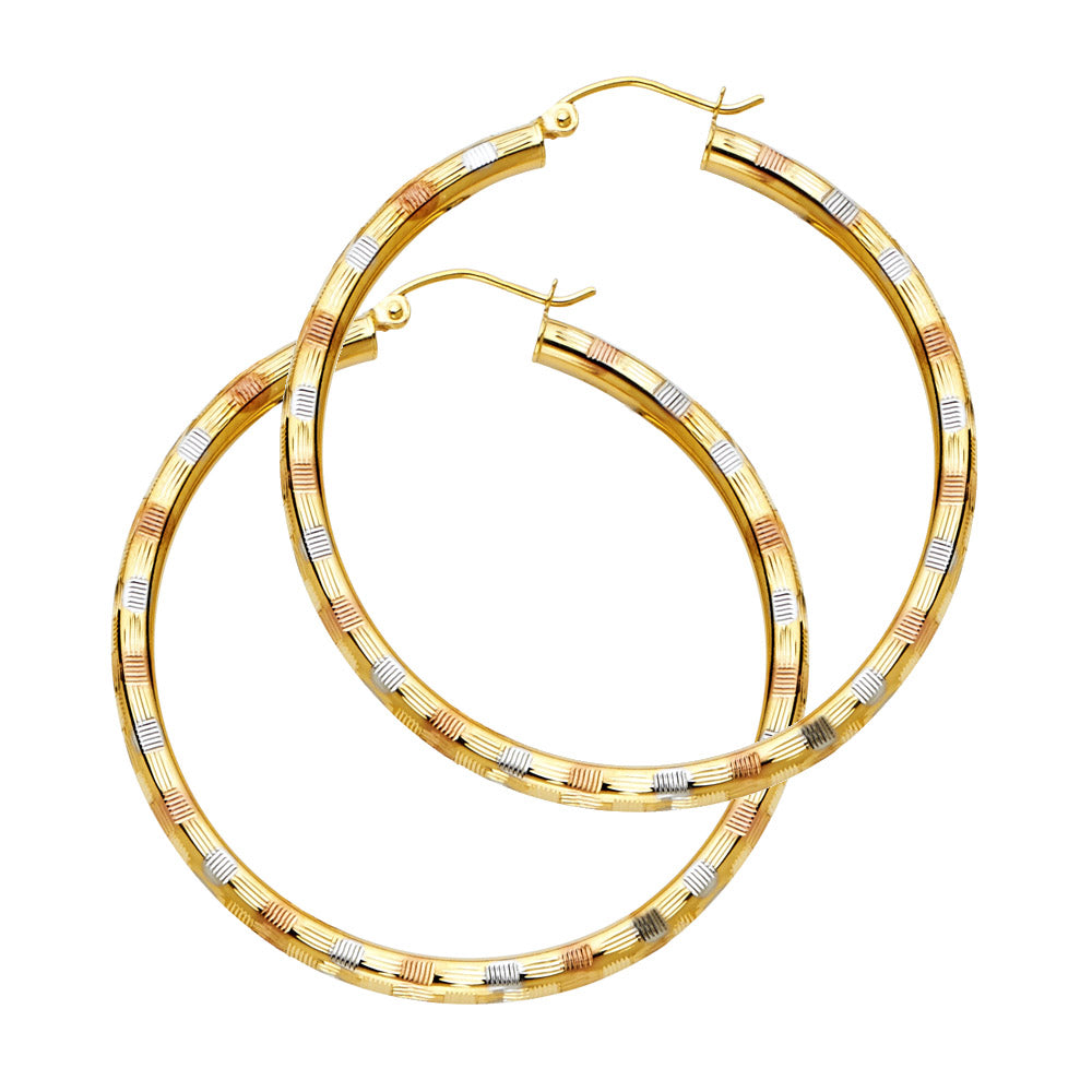 Gold hoop earrings with a textured design on a white background available on the TX.ORO website.