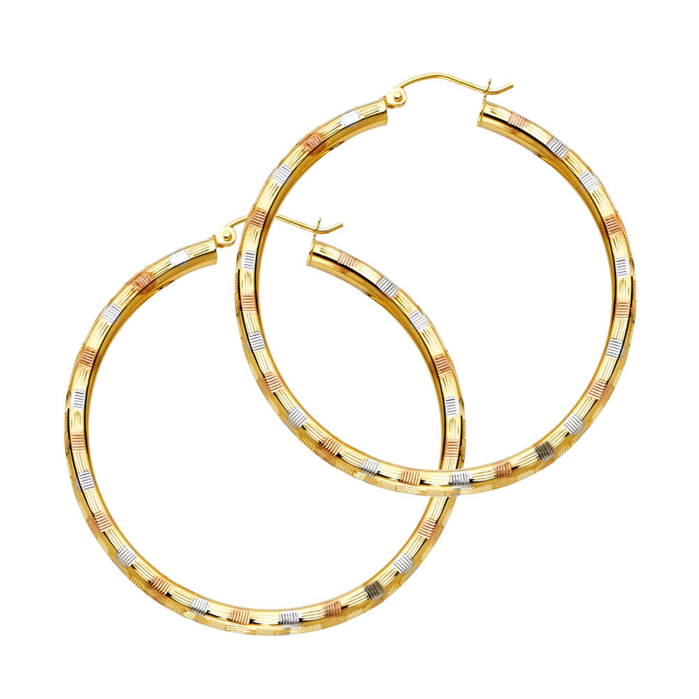 Gold hoop earrings with a textured design on a white background available on the TX.ORO website.
