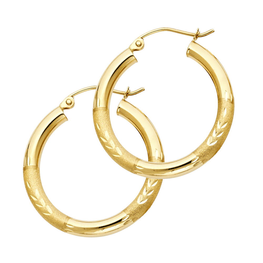 Gold hoop earrings on a white background available on the TX.ORO website.