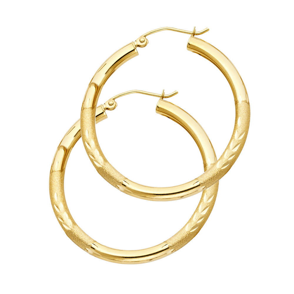 Gold hoop earrings on a white background available on the TX.ORO website.