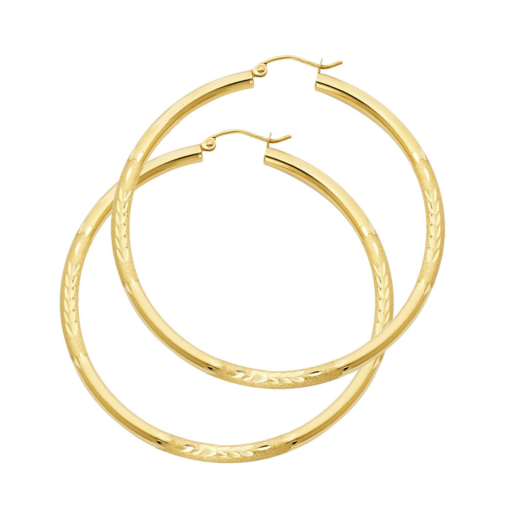 Gold hoop earrings on a white background available on the TX.ORO website.