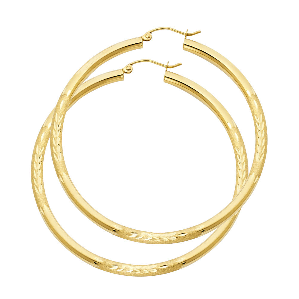 Gold hoop earrings on a white background available on the TX.ORO website.
