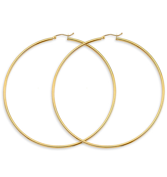 Gold hoop earrings on a white background available on the TX.ORO website.