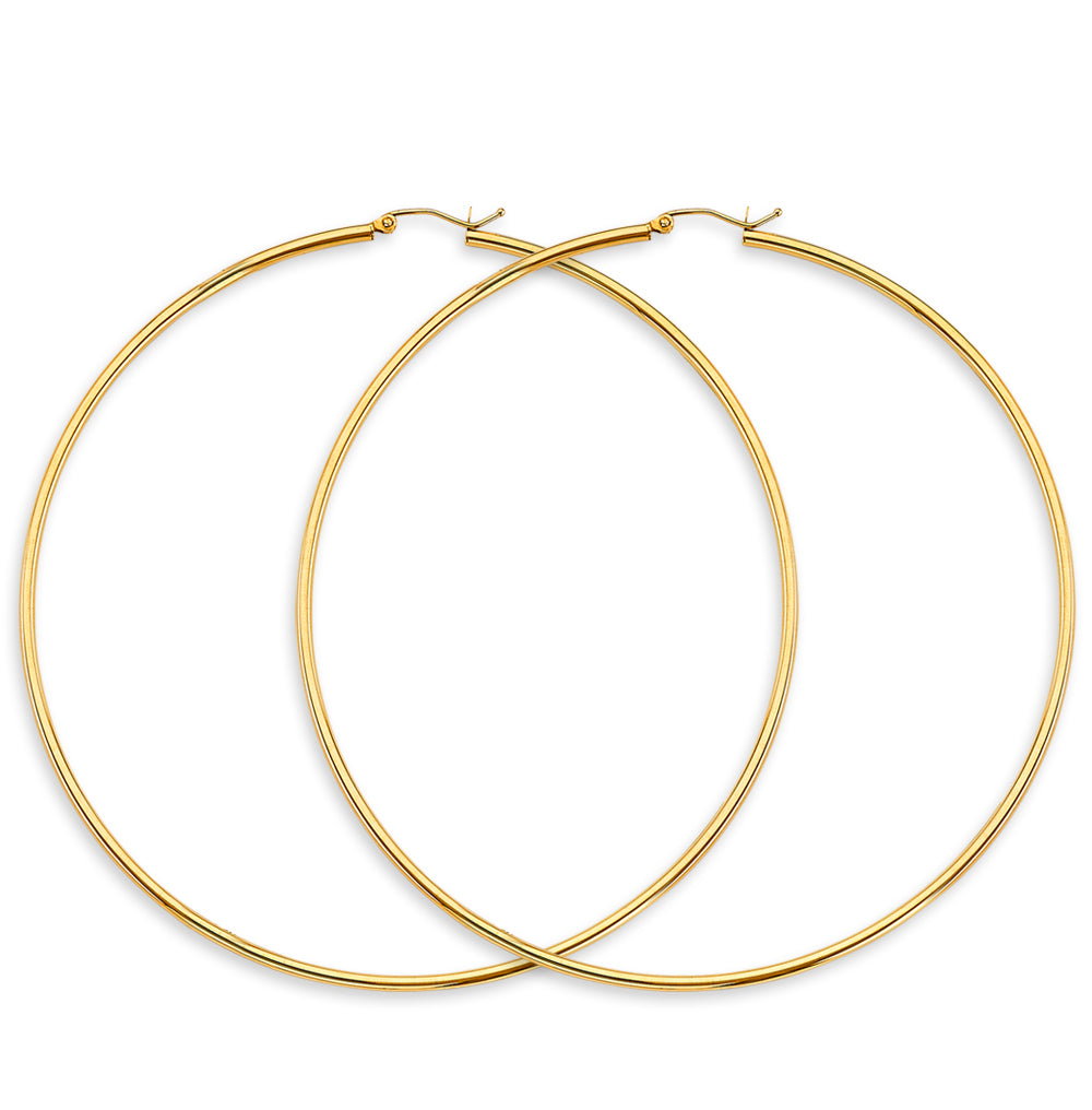Gold hoop earrings on a white background available on the TX.ORO website.