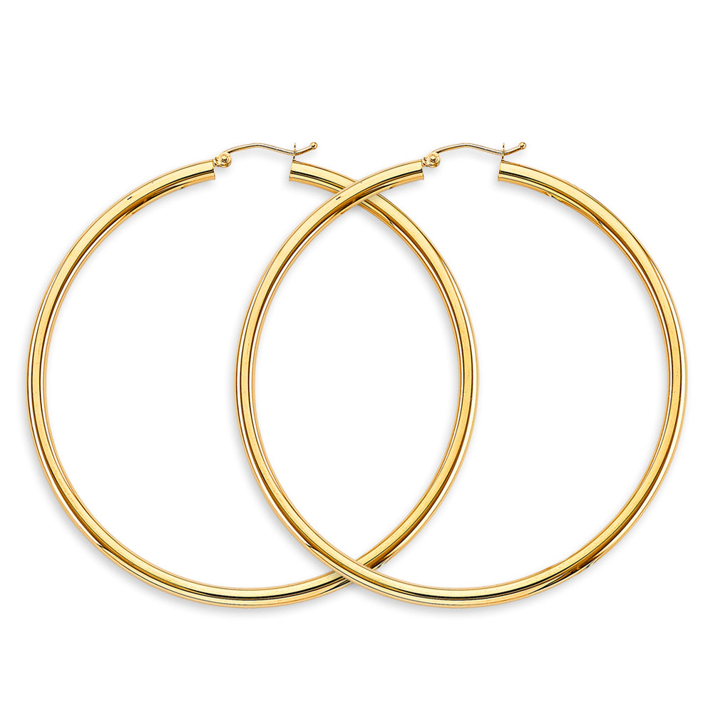Gold hoop earrings on a white background available on the TX.ORO website.