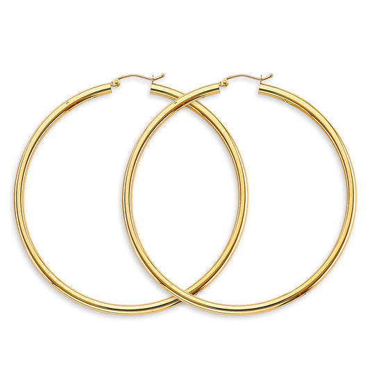 Gold hoop earrings on a white background available on the TX.ORO website.