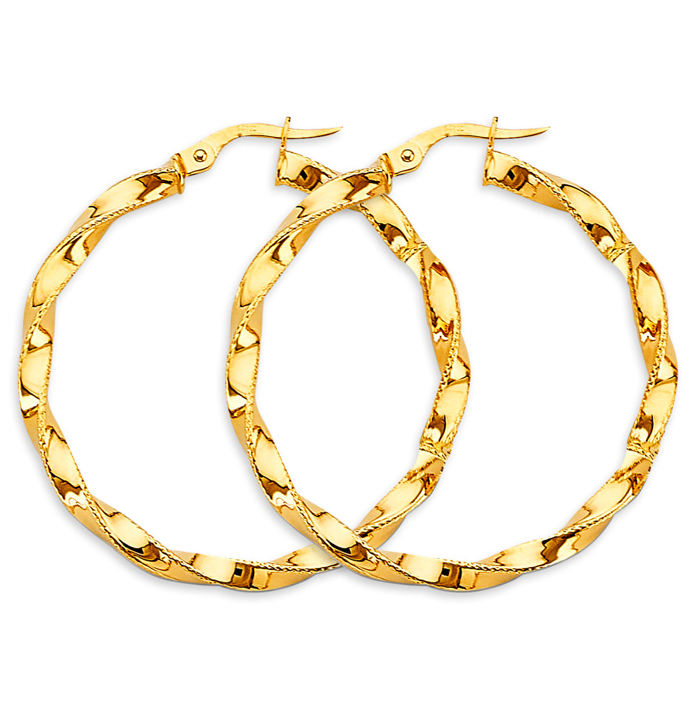 Gold hoop earrings on a white background