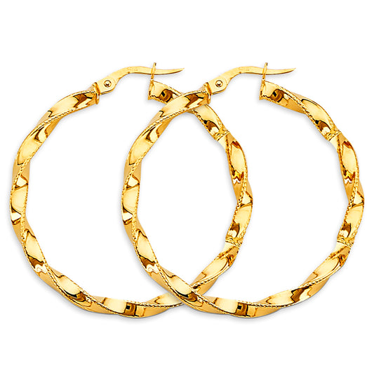 Gold hoop earrings on a white background