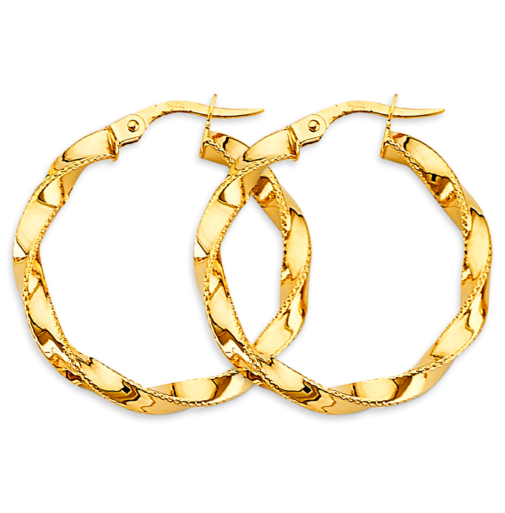 Gold hoop earrings on a white background