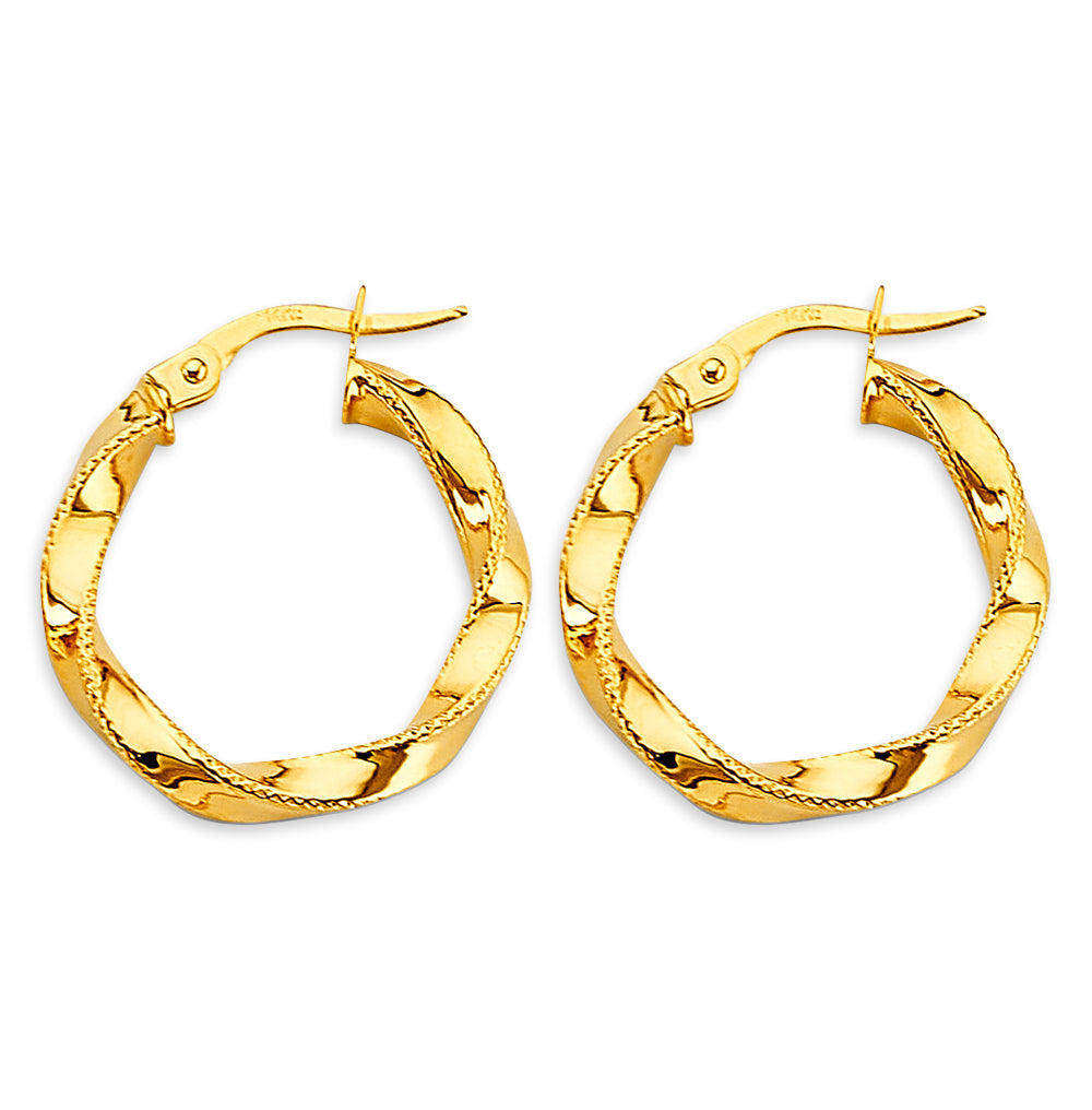 Gold hoop earrings on a white background