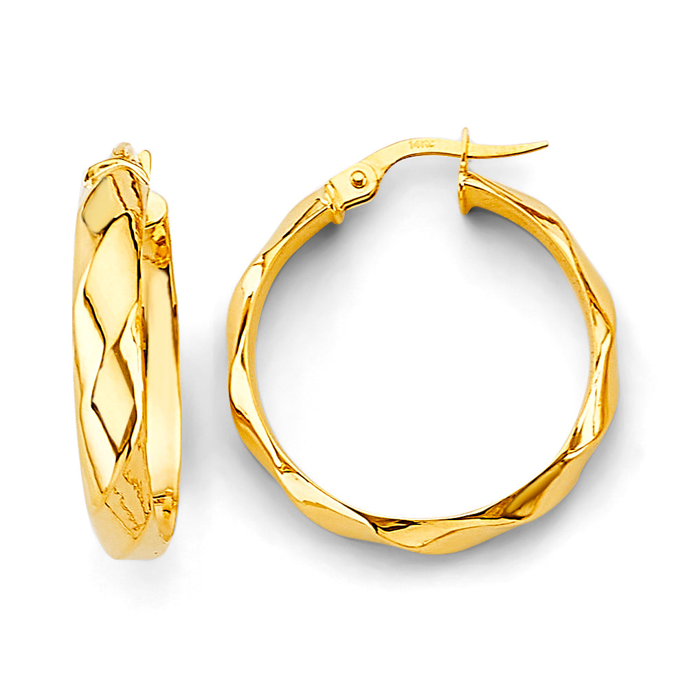 Gold hoop earrings on a white background