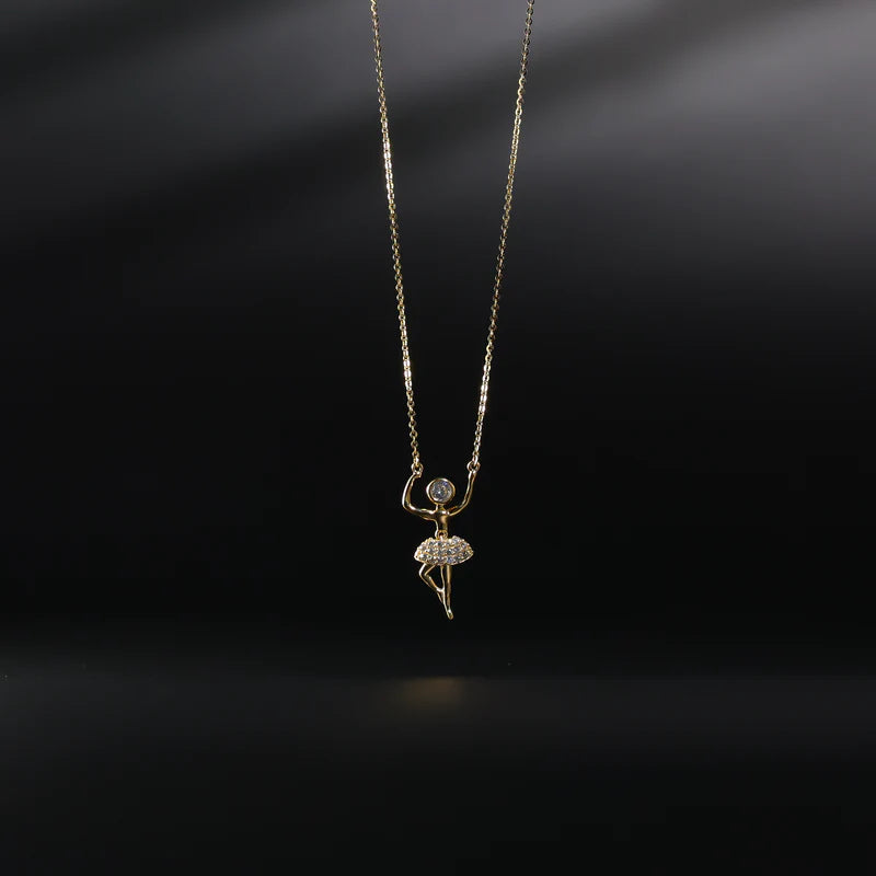 Necklace with a ballerina pendant on a dark background available on the TX.ORO website.