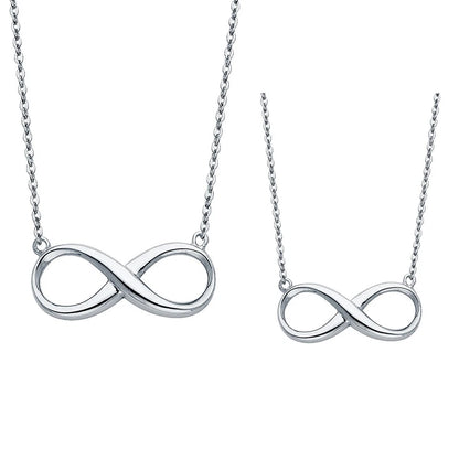 Two silver infinity symbol necklaces on white background available on the TX.ORO website.