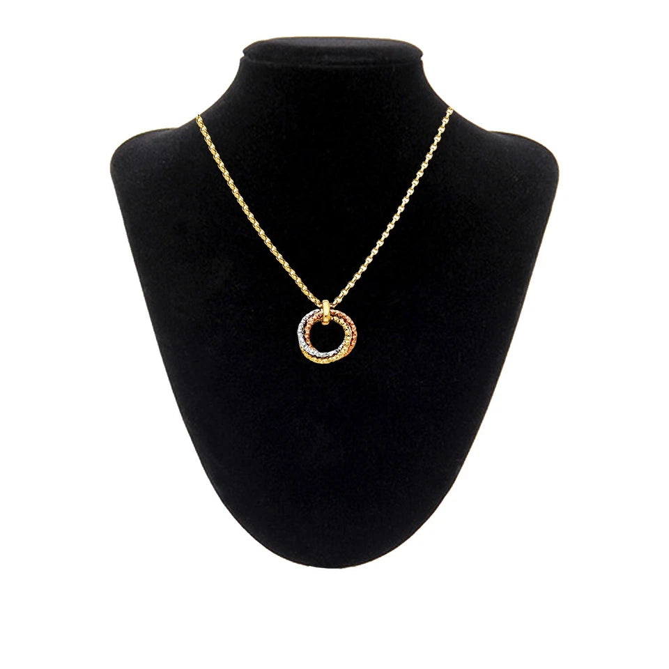 Gold necklace with a circular pendant on a black bust available on the TX.ORO website.