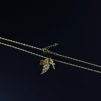 Gold necklace with a pendant on a black background available on the TX.ORO website.