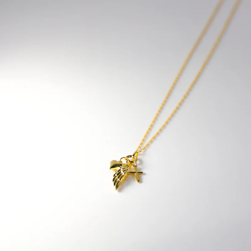 Gold necklace with a leaf-shaped pendant on a light gray background available on the TX.ORO website.