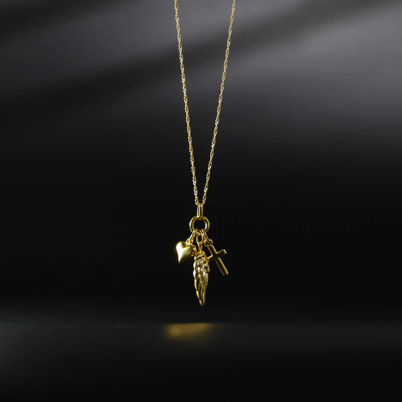 Gold necklace with a pendant on a black background available on the TX.ORO website.