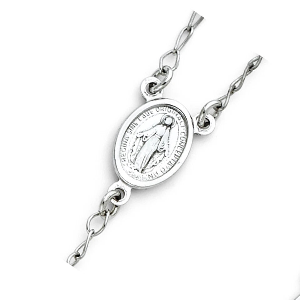 Silver bracelet with a religious pendant on a white background availabe on TX.ORO website.