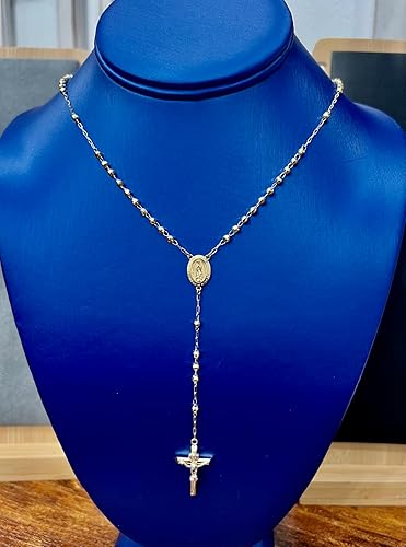 Silver rosary necklace on a blue mannequin bust availabe on TX.ORO website.