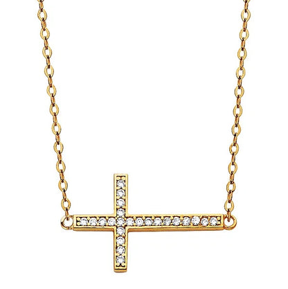 Gold cross necklace with diamonds on a white backgroundavailable on the TX.ORO website.