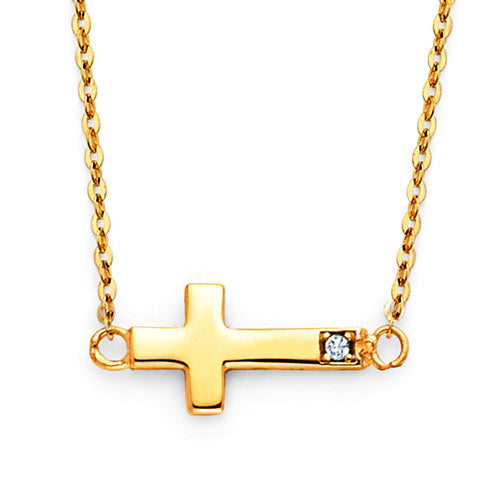 Gold cross necklace with a diamond on a white background available on the TX.ORO website.