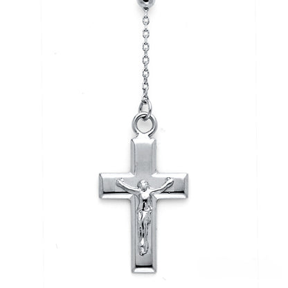 Silver cross pendant with Jesus figure on a white background available on the TX.ORO website.