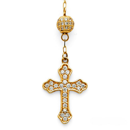 Gold cross pendant with clear stones on a white background available on the TX.ORO website.