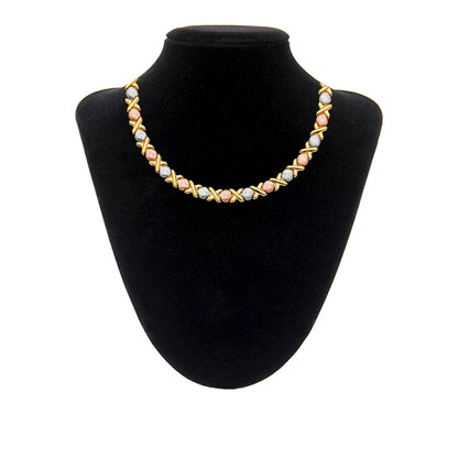 Necklace on a black mannequin bust with a white background available on the TX.ORO website.