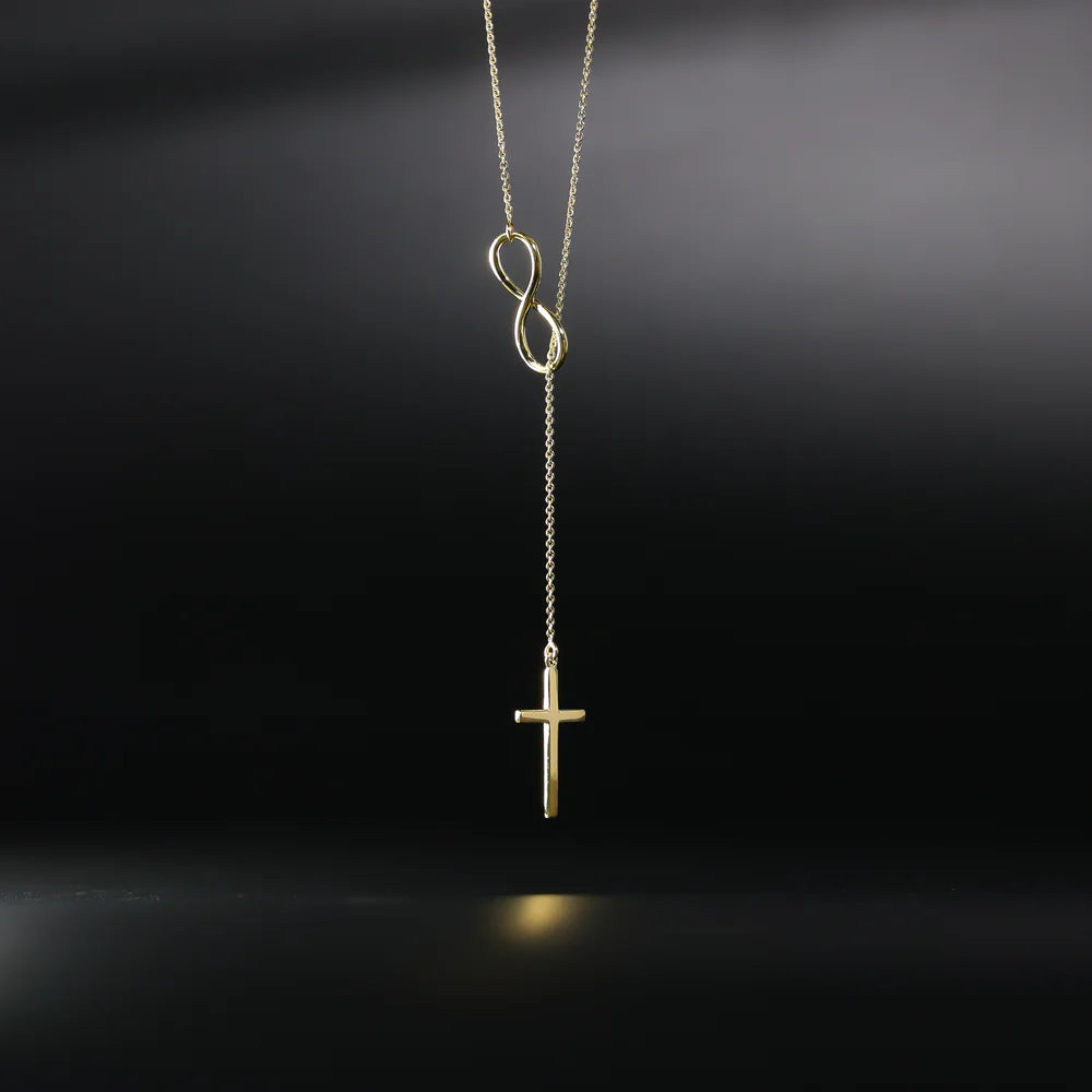 Gold necklace with an infinity symbol and cross pendant on a black background available on the TX.ORO website.