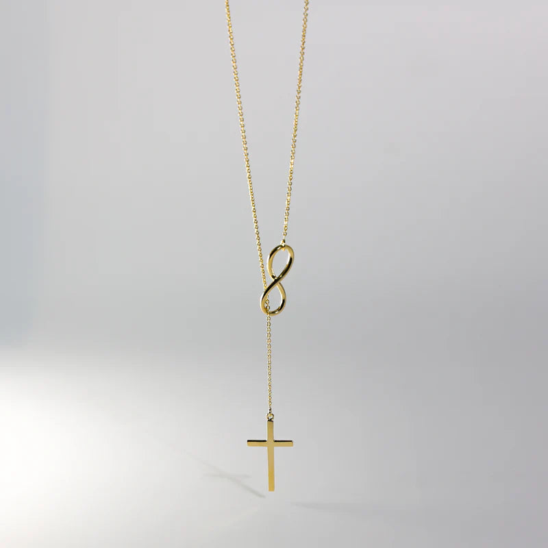 Gold necklace with an infinity symbol and cross pendant on a light gray background available on the TX.ORO website.