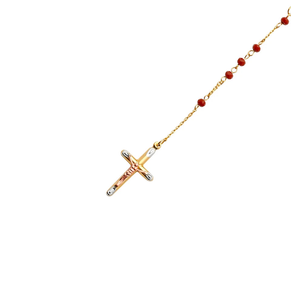 Gold necklace with a cross pendant on a white background available on the TX.ORO website.