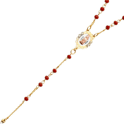 Gold necklace with red beads on a white background available on the TX.ORO website.