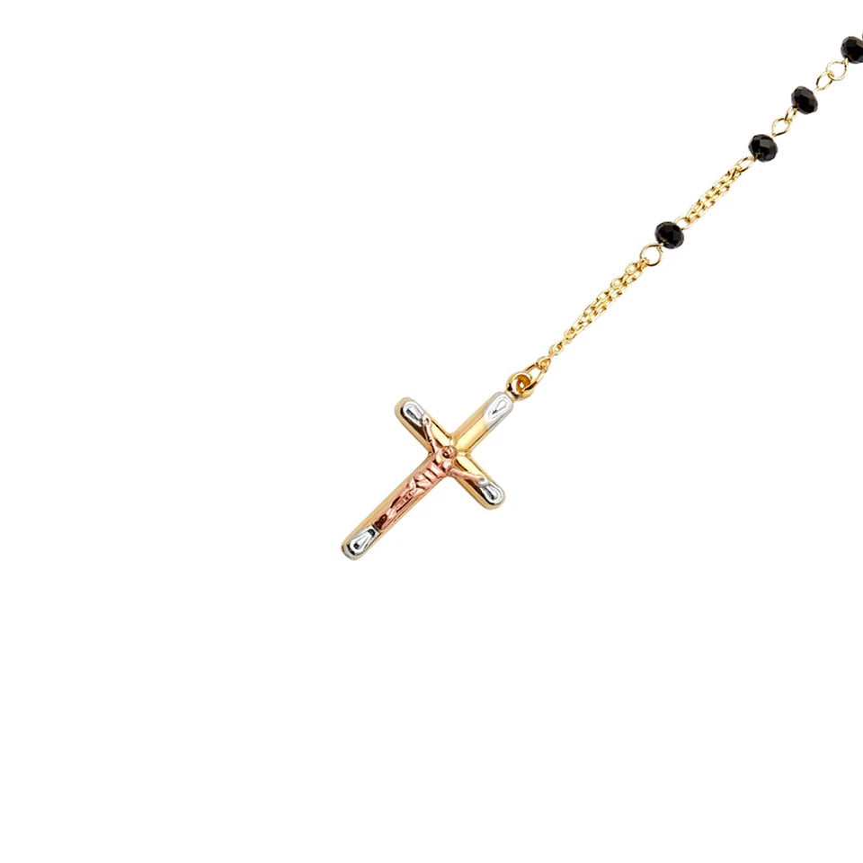 Gold and rose gold cross necklace with black beads on a white background available on the TX.ORO website.