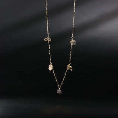 Gold necklace with three pendant drops on a dark background available on the TX.ORO website.