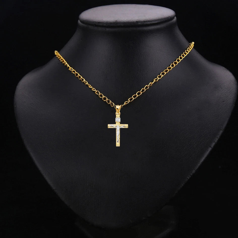 Gold necklace with a cross pendant on a black mannequin bust