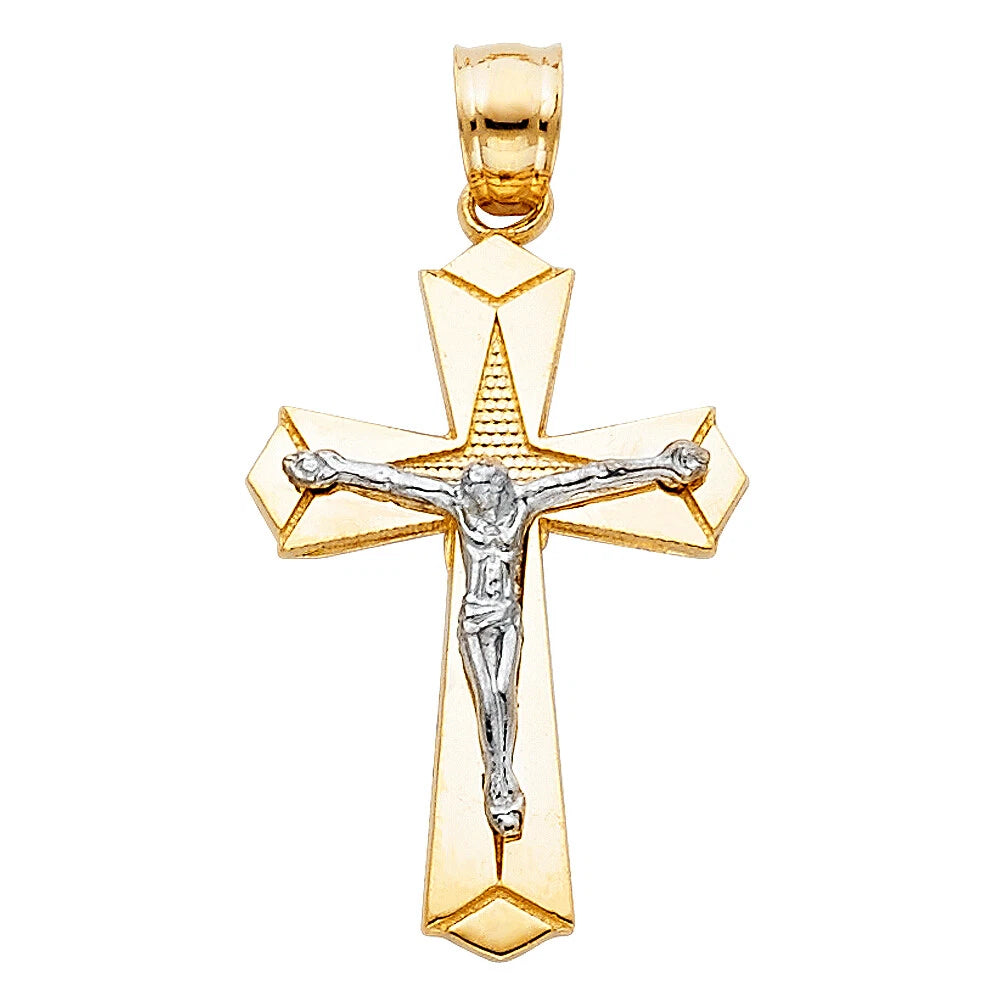Gold and silver crucifix pendant on a white background