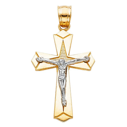 Gold and silver crucifix pendant on a white background