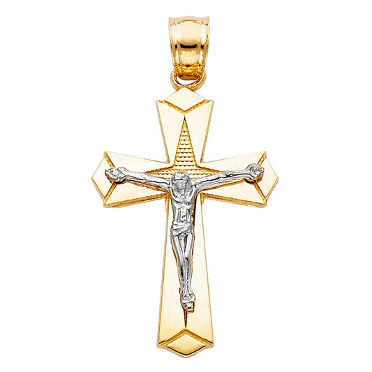Gold and silver crucifix pendant on a white background