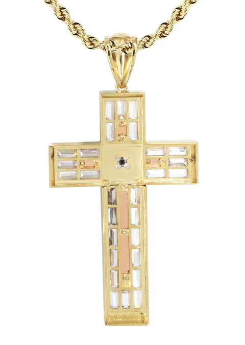 Gold cross pendant with a central diamond on a white background available on the TX.ORO website.