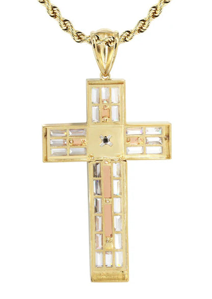Gold cross pendant with a central diamond on a white background available on the TX.ORO website.
