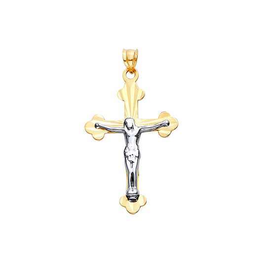 Gold and silver crucifix pendant on a white background