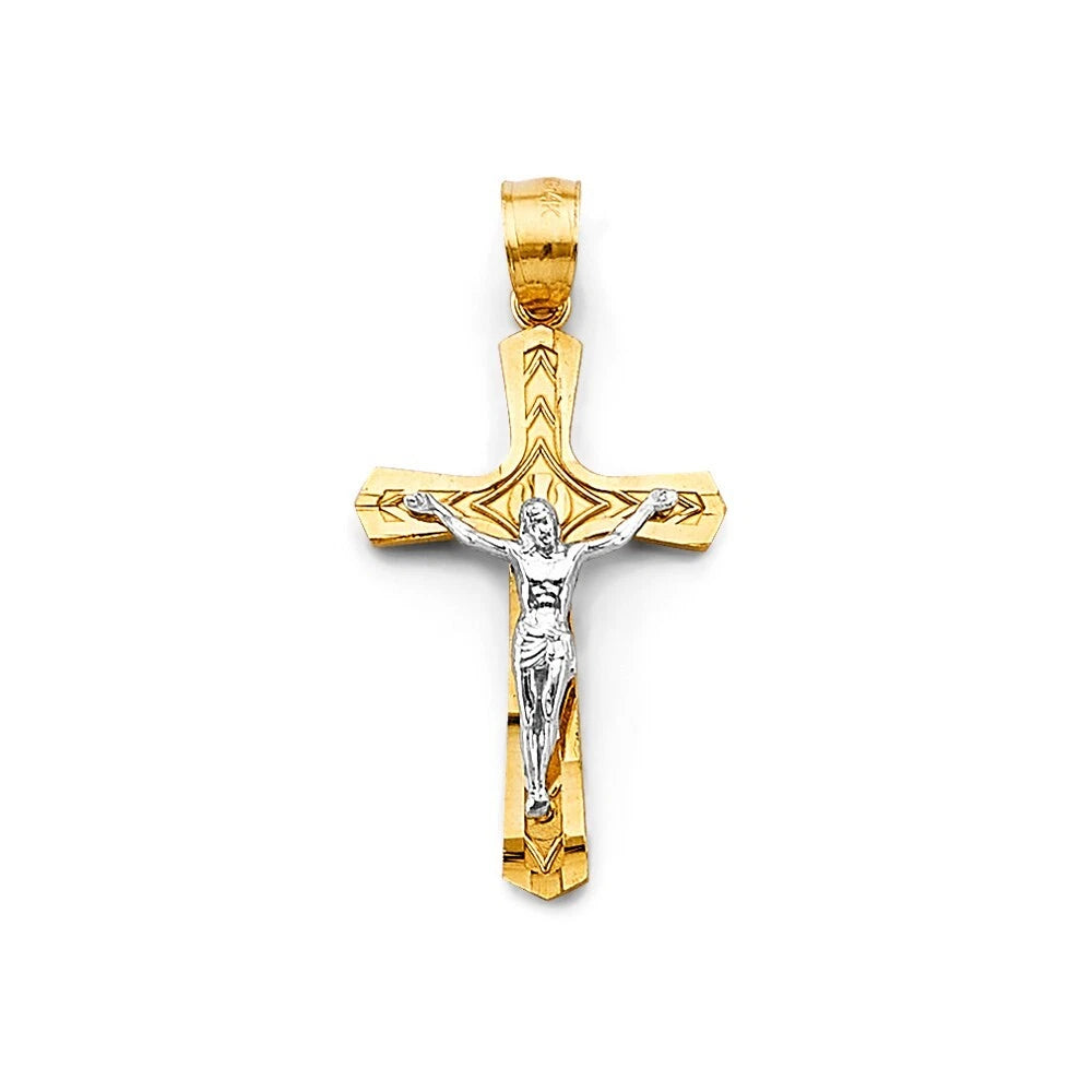 Gold and silver crucifix pendant on a white background