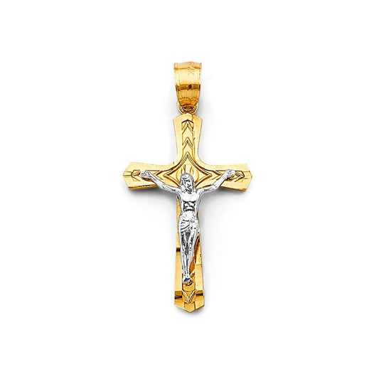 Gold and silver crucifix pendant on a white background