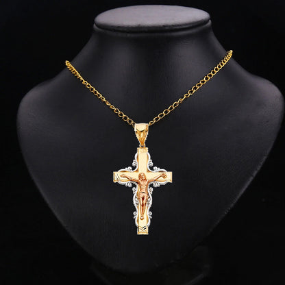 Gold cross pendant necklace on a black mannequin bust