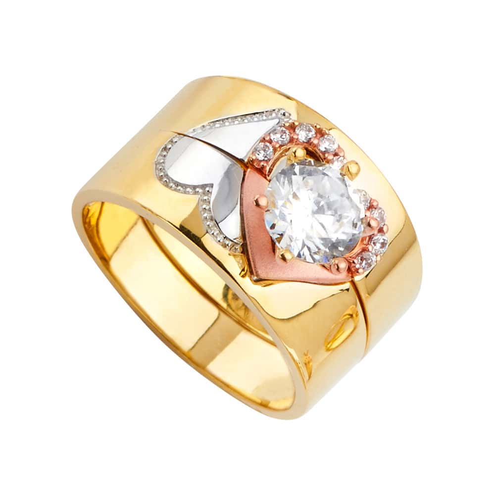Gold ring with heart design and central gemstone on a white background availabe on TX.ORO website.