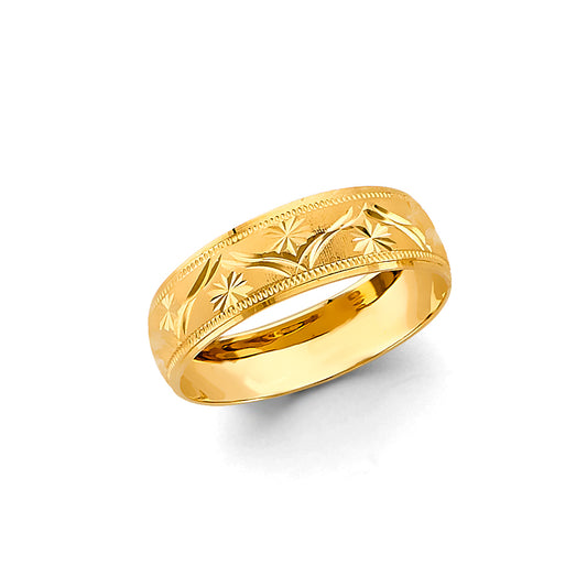Gold ring with intricate designs on a white background