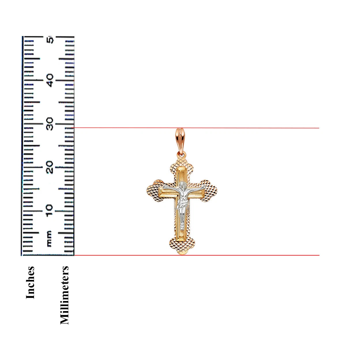 A gold and silver cross pendant with a central silver figure, shown next to a black inch-and-millimeter ruler on a white background.